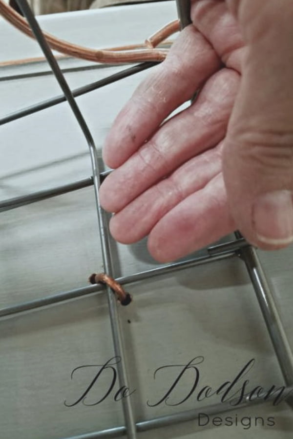 Use wire to secure the basket to the   back side of the cabinet door. 