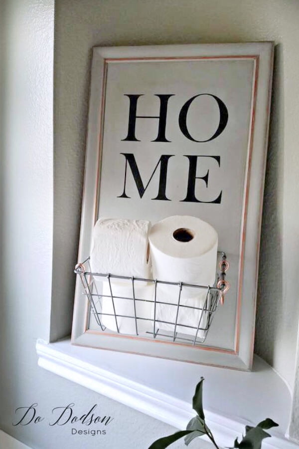 Try this easy DIY toilet paper caddy made from a repurposed cabinet door. 
