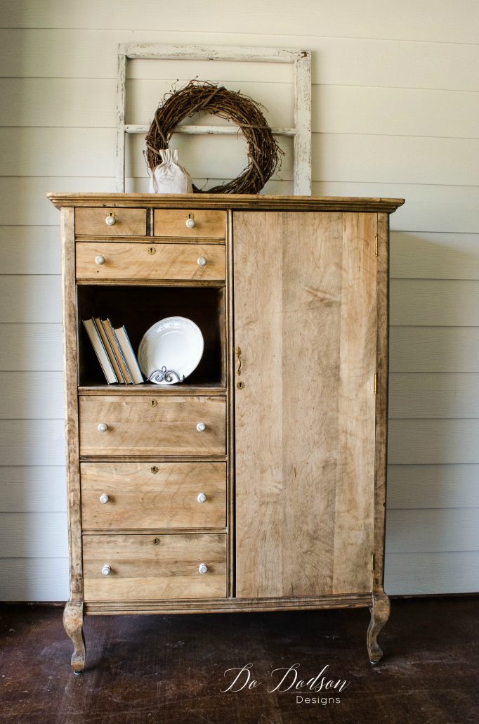 Raw wood farmhouse style armoire.