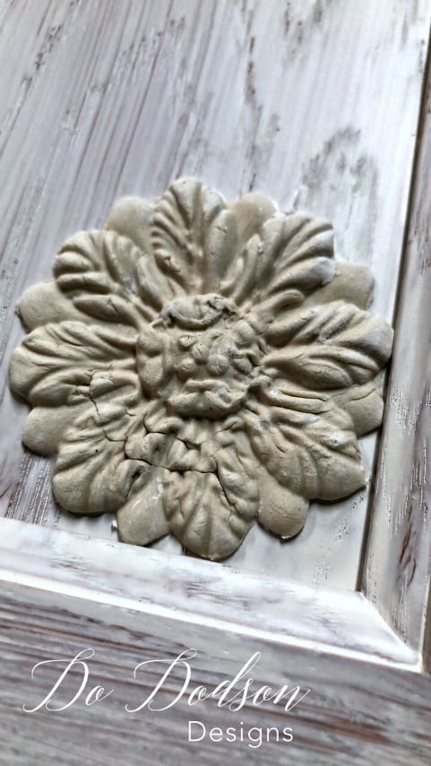 I added these beautiful decor moulds to a cabinet door to create unique wall art. 