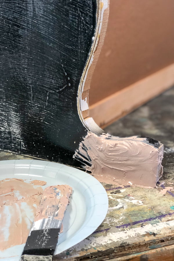 There's nothing magical about the application. I just smoothed it on with a wood craft stick and applied it thick. Just above the level needed to match the wood. The Bondo was dry after about an hour and was ready for sanding. This furniture repair project is coming along nicely. 