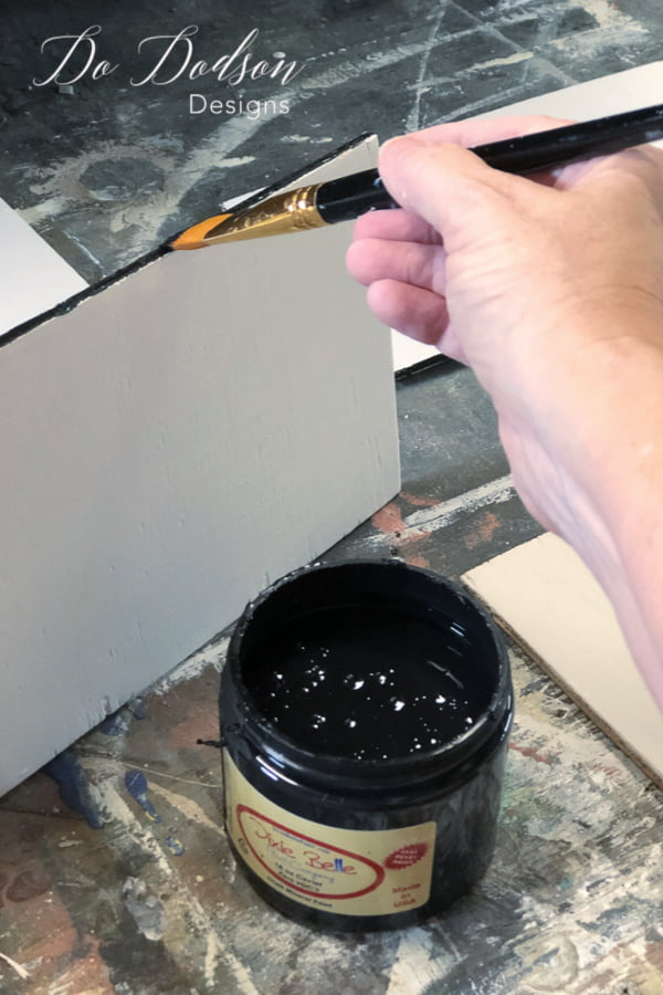 Paint the inside strips of the plywood black to make sure that the gaps between the faux shiplap looks authentic. 