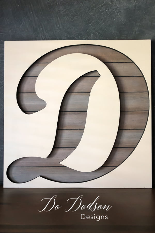 Custom painted wood letter cutouts with a faux painted wood backer board.