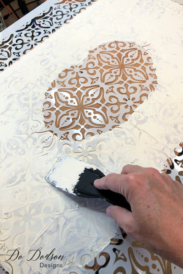 To apply a raised stencil on your furniture, you will need a few items. A beautiful 3D stencil and some mud.
