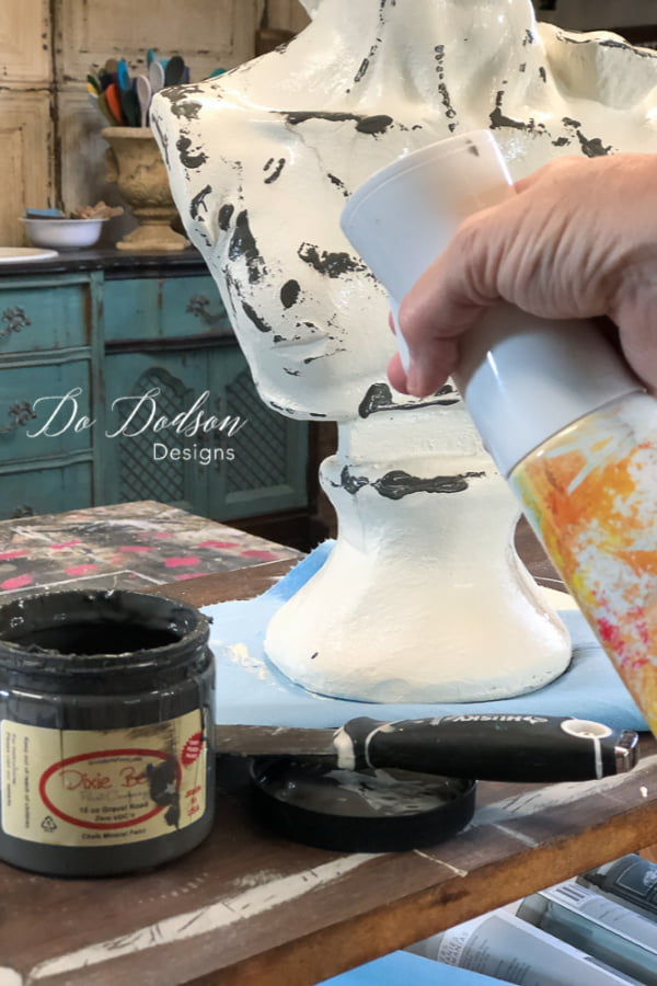 Before adding an aged patina finish on my thrift store find, I created a drippy finish with paint and a spray mist water bottle. 
