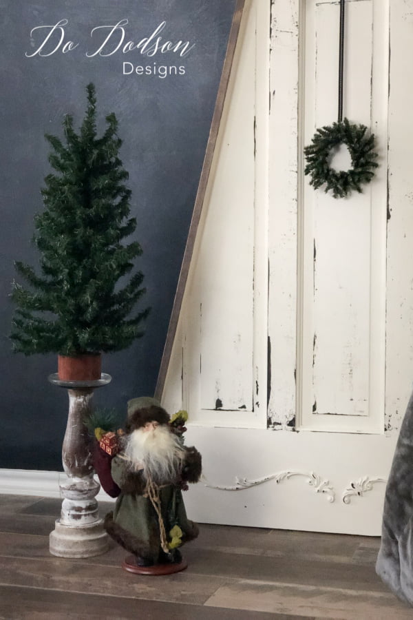 This was the best use of an old door! I cut it into the shape of a Christmas tree! It's perfect for small spaces. 