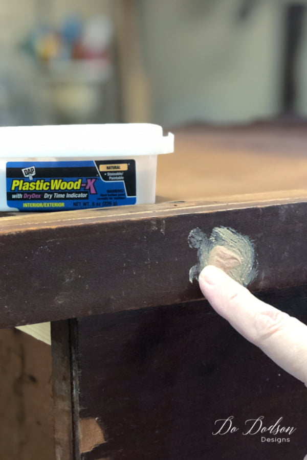 Add extra wood filler to cover the holes and allow them to dry.