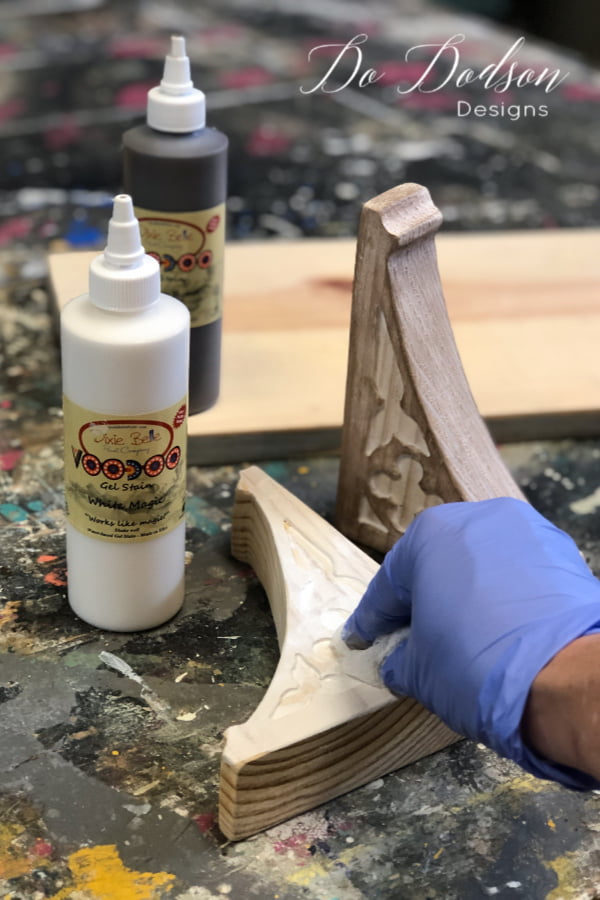 To get the look of a vintage corbel, start with applying a white water-based stain to the wood with a soft cotton cloth. You can also brush the stain on with a chip brush and wipe back any extra. You just want to stain the wood not saturate it. Then while the white stain is still wet, apply the brown (Tobacco Road) stain to create a light creamy brown finish.