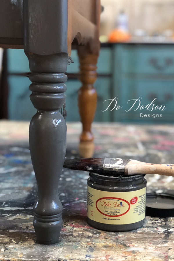 With a layered paint look on furniture, I like to start with a dark color as my base coat. 