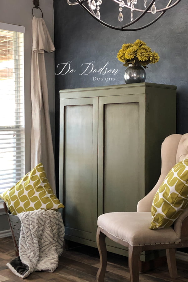 Olive chalk paint and chartreuse accents make this cabinet a winner for sure.