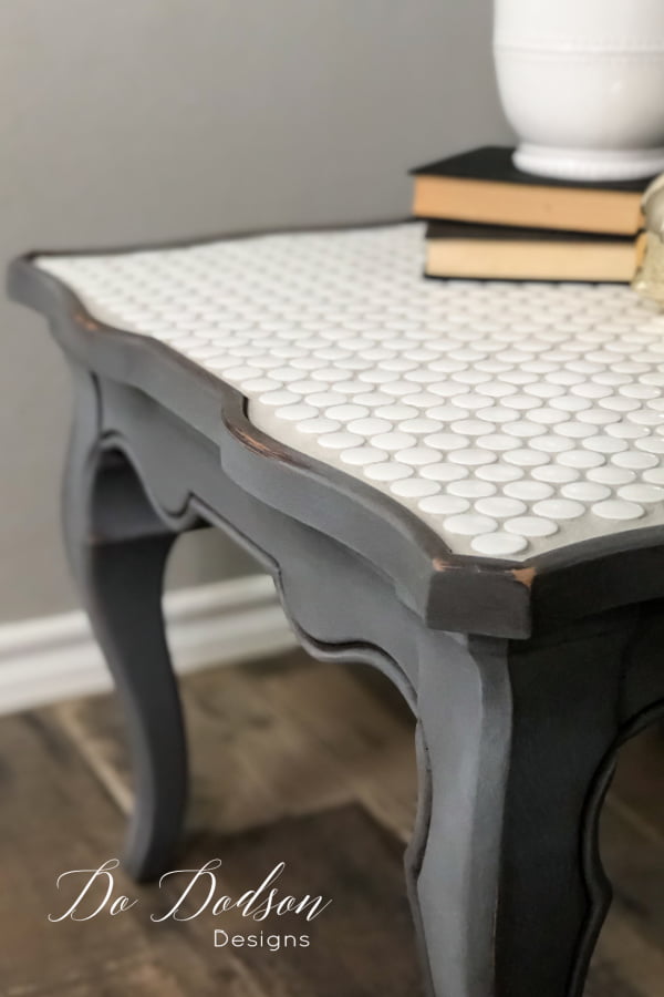 This DIY tiled table top makeover was super easy and budget friendly. The perfect idea for salvaging a table that isn't quite your style. 