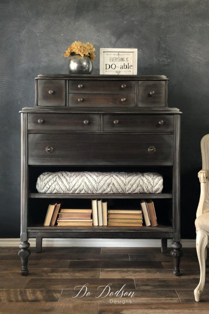 This style is one of my favorite ways to decorate inside a narrow bookshelf, or a missing drawer turned into a shelf like this vintage dresser. While I love symmetry, I also like to mix things up a bit to give the eyes a place to travel. This makes for an interesting pattern when decorating with books.