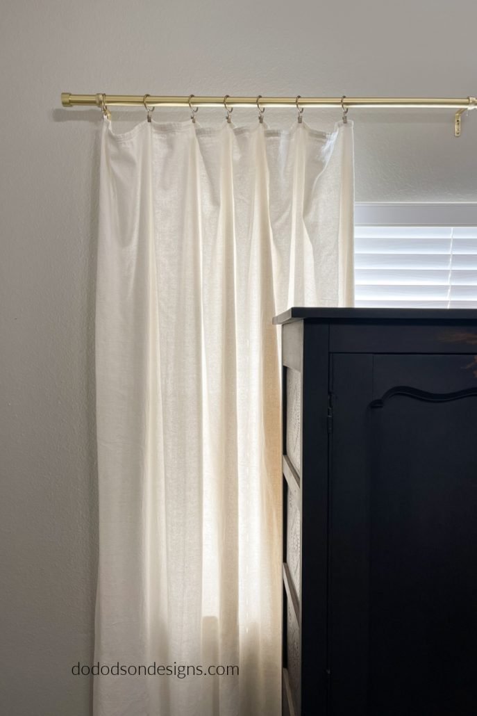 Try hanging your DIY drop cloth curtains with ring clips like this if you want a more laid back, casual farmhouse style.