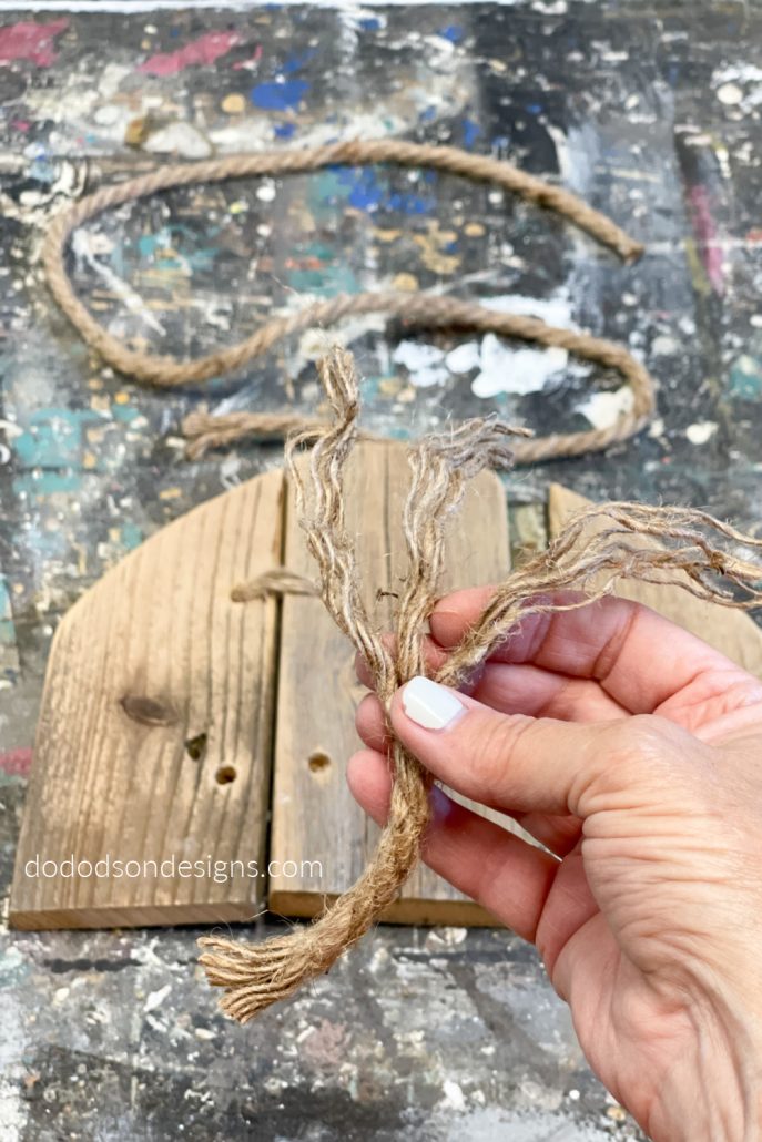After threading the jute twin and connecting the wood pumpkin pieces together, you can paint and embellish them to match your Fall home decor style.