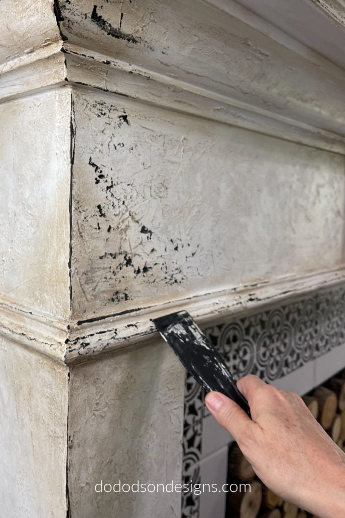 This faux chippy paint look is easily obtainable and not only looks great on furniture but I used this technique on my fireplace as well.