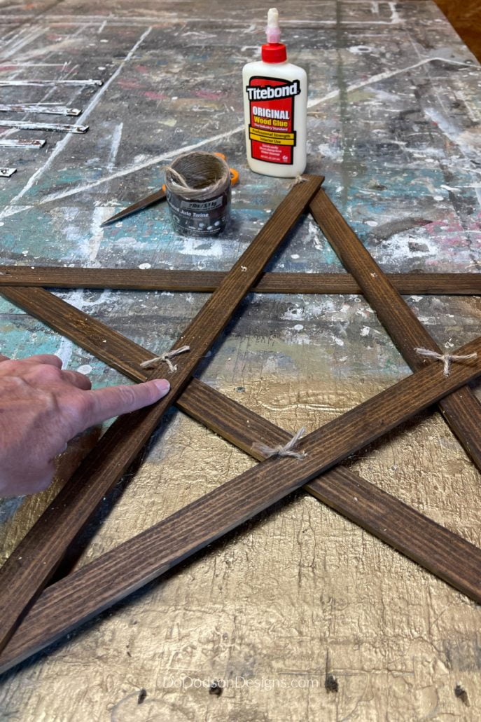Using scrap wood strips and tying them together with jute made the perfect rustic Christmas wooden star. 